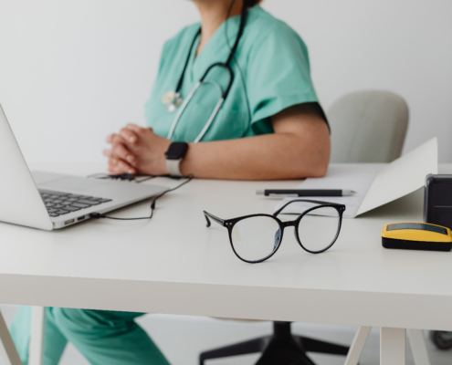 a doctor using MacBook pro