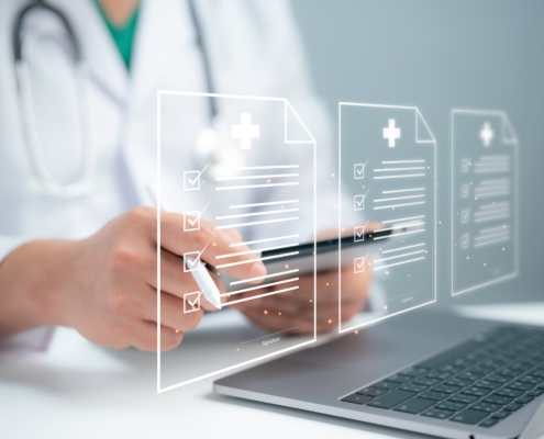 A healthcare professional using a digital tablet and laptop with floating digital medical records, representing secure data access. This image highlights the importance of cybersecurity in healthcare IT. Ideal for illustrating unified threat management solutions in Dallas.